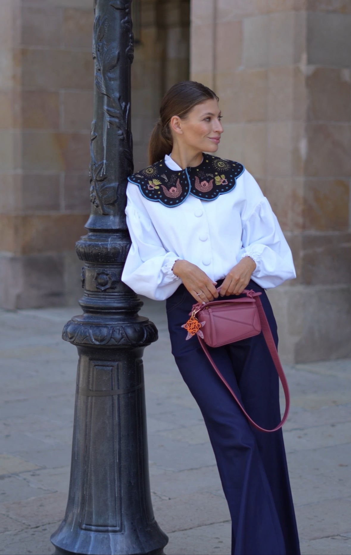 Off-white denim jacket with buff sleeves.