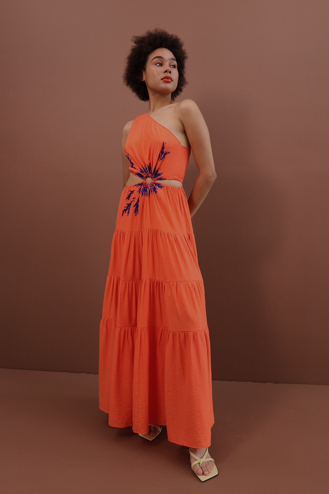 Orange dress with hand-made embroidery.